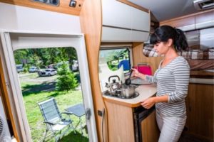 Woman-Cooking-Comfortably-in-an-RV 3